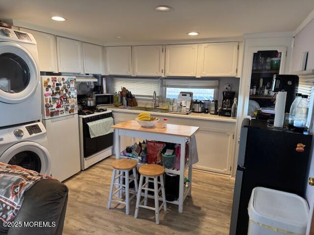 127 Lane B Hazlet, NJ 07730 - Photo 5 of 13 a kitchen with stainless steel appliances granite countertop a table chairs sink and cabinets
