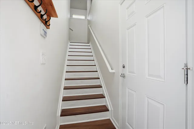 a kitchen with stainless steel appliances granite countertop a sink and a stove
