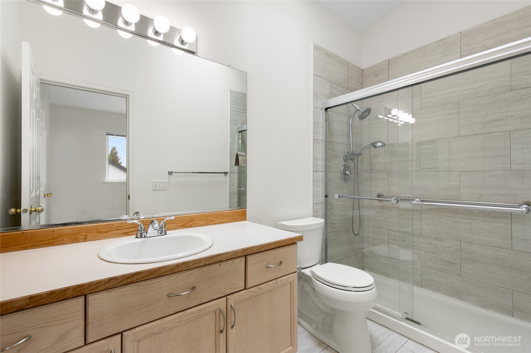 22619 4th Avenue West, Unit 3103 Bothell, WA 98021 - Photo 15 of 26 a bathroom with a sink a toilet and shower
