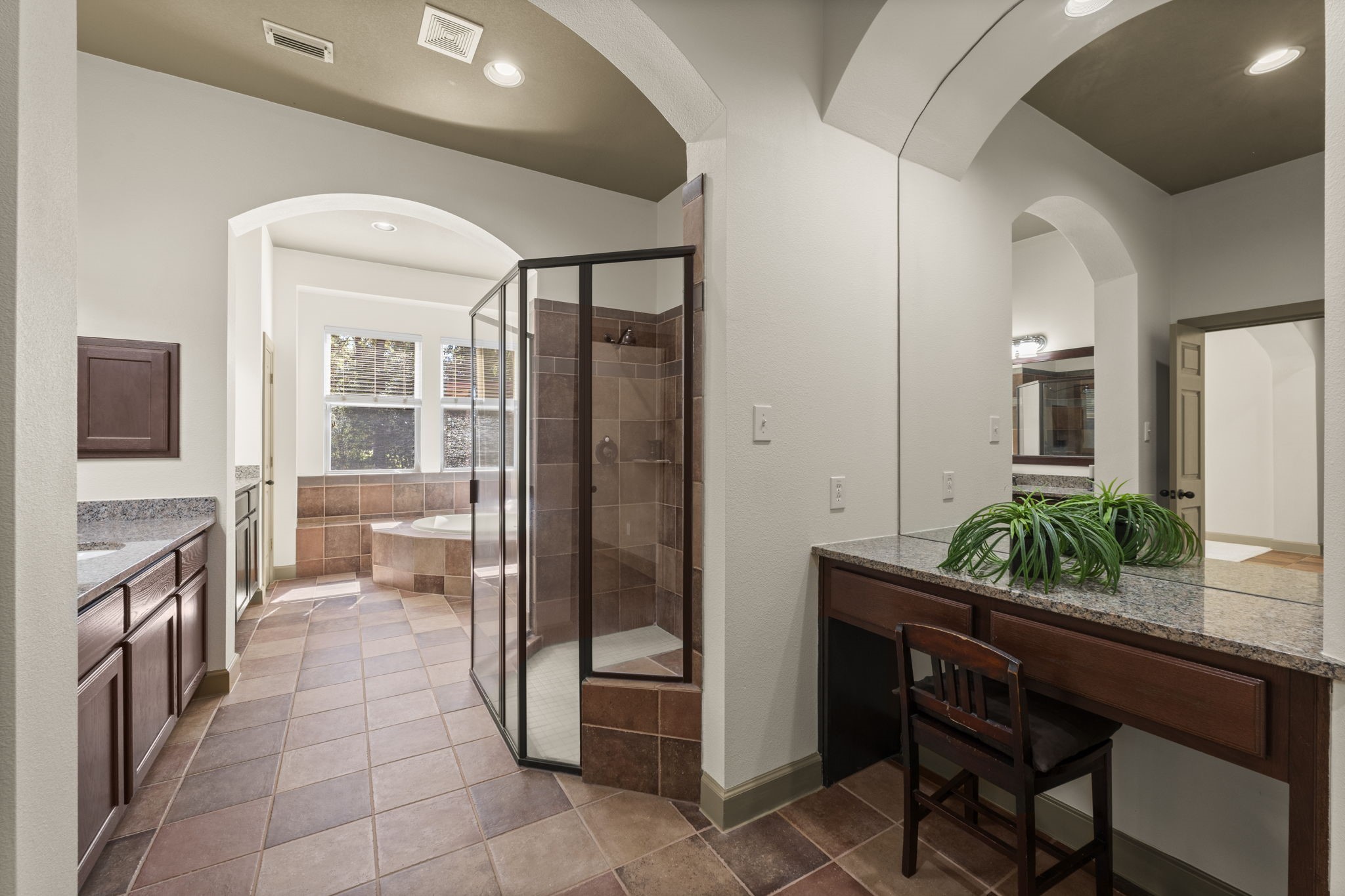 1534 Virgie Community Road Magnolia, TX 77354 - Photo 28 of 50 The primary bathroom features two large and separated sink areas, separate large oversized shower and jetted tub, make up counter and an unbelievable walk in closet.