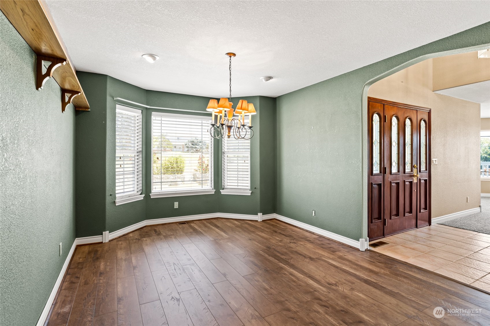 830 St Hilaire Road Yakima, WA 98901 - Photo 7 of 39 a view of an empty room with a window and wooden floor