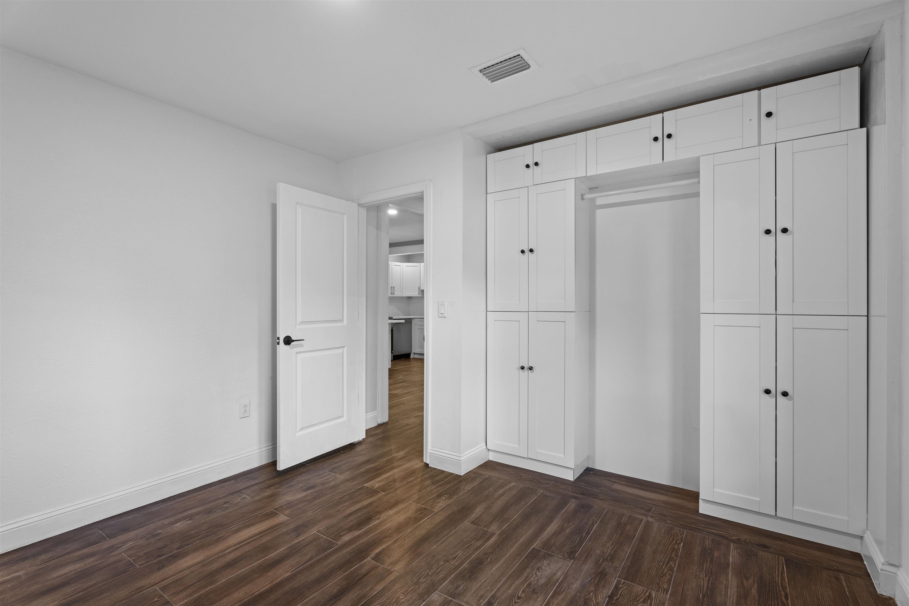 136 Washington Street St. Augustine, FL 32084 - Photo 20 of 50 a view of an empty room with wooden floor