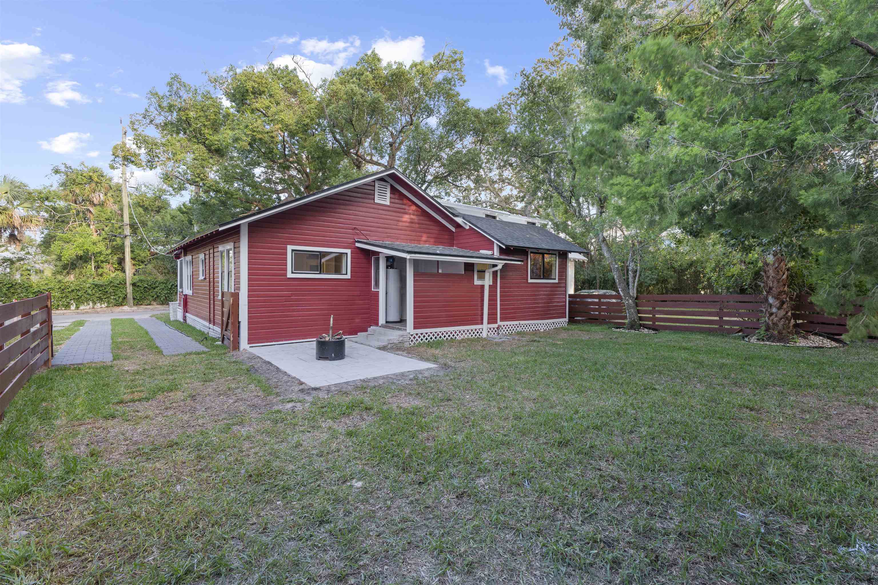 136 Washington Street St. Augustine, FL 32084 - Photo 32 of 50 a view of backyard of house with green space