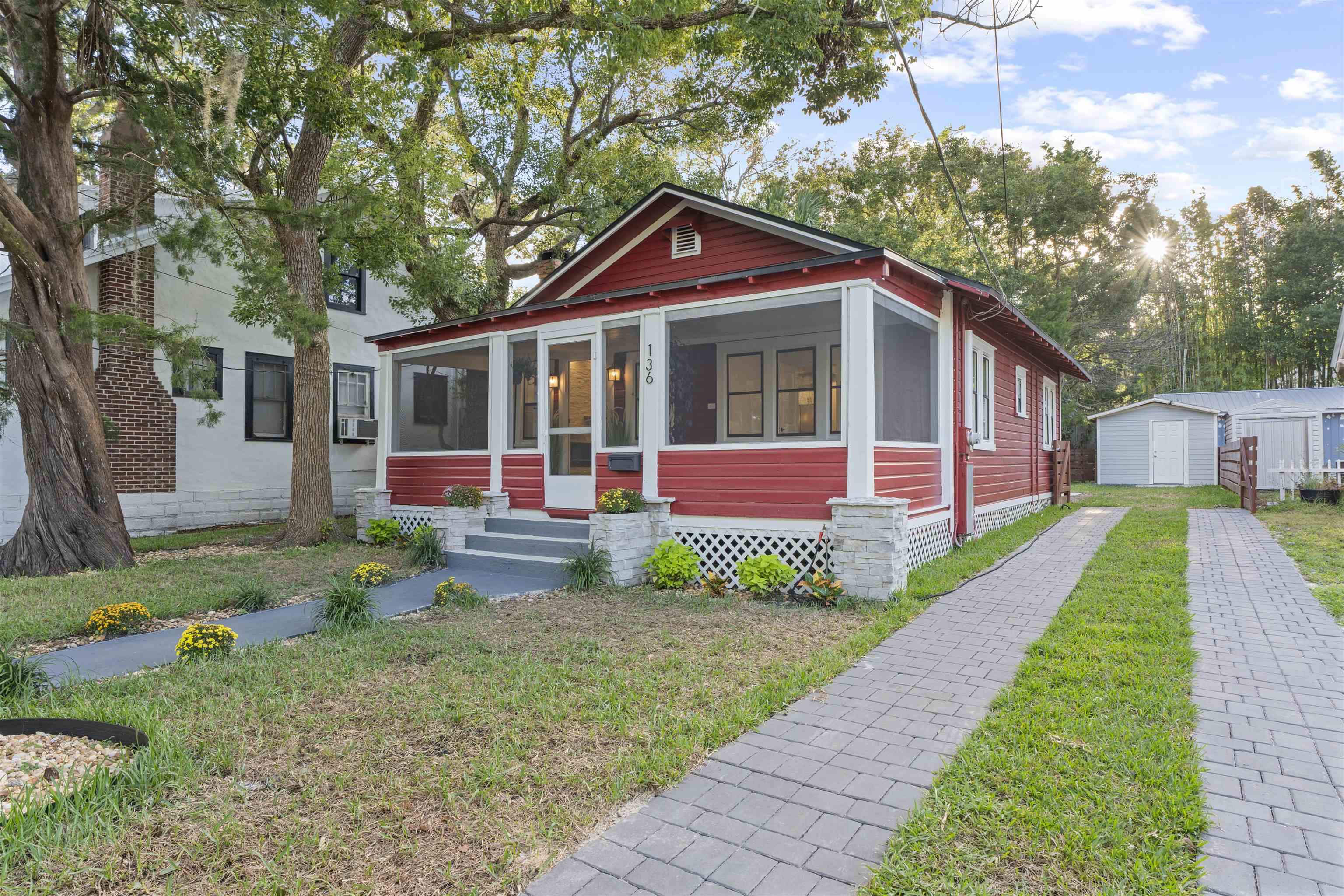 136 Washington Street St. Augustine, FL 32084 - Photo 4 of 50 a front view of a house with yard
