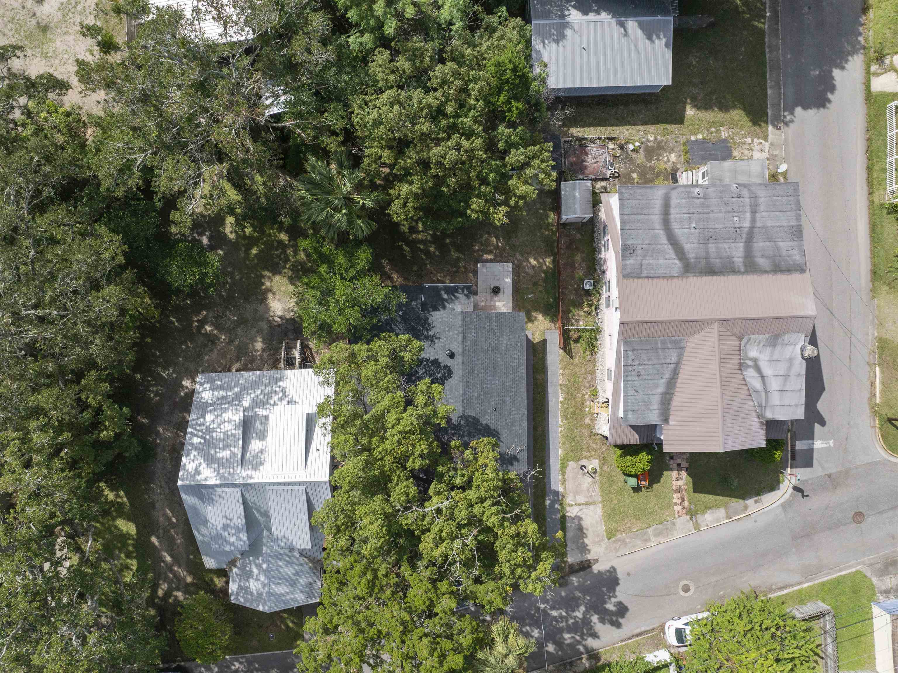136 Washington Street St. Augustine, FL 32084 - Photo 42 of 50 an aerial view of a house with a yard and garden