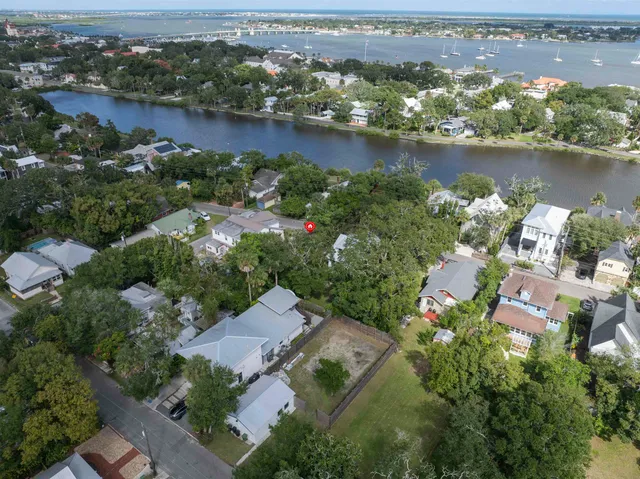 an aerial view of lake and residential houses with outdoor space and lake view