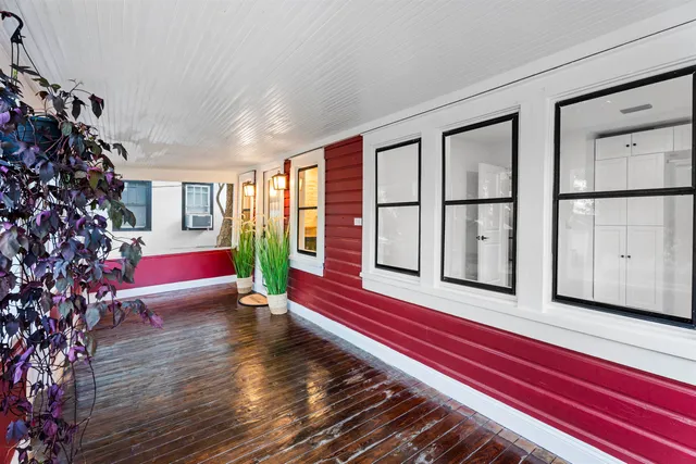 a view of livingroom with furniture wooden floor and windows