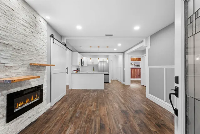 a view of kitchen with furniture and fireplace