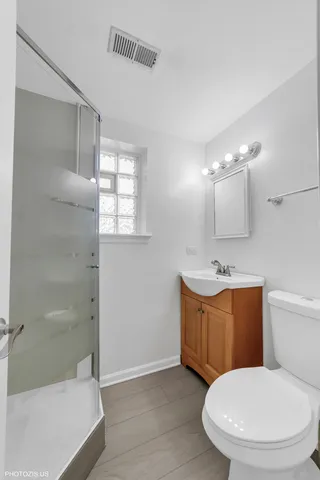 a bathroom with a toilet a sink and bathtub