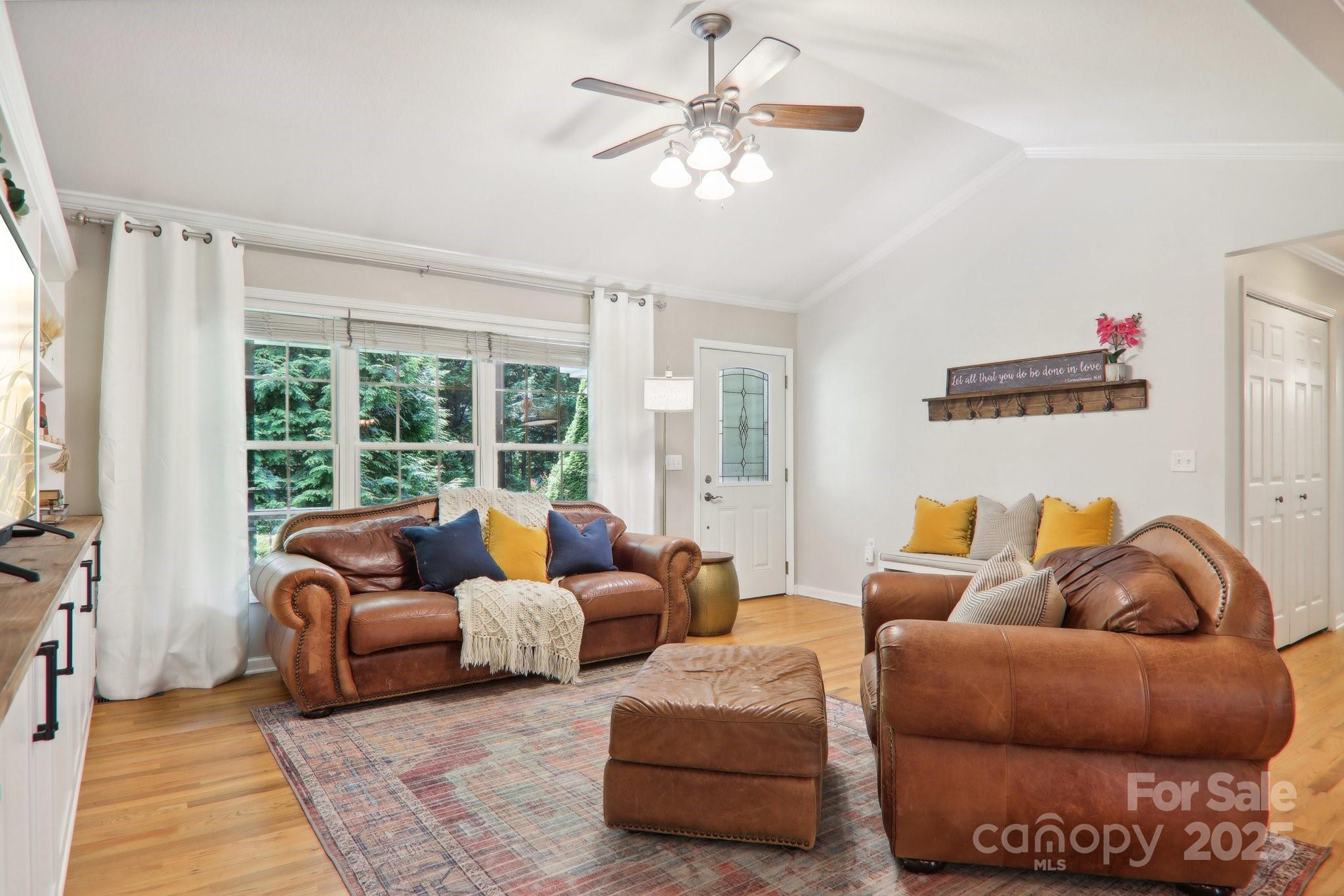 33 Warlick Road Mills River, NC 28759 - Photo 12 of 48 a living room with furniture ceiling fan and a window