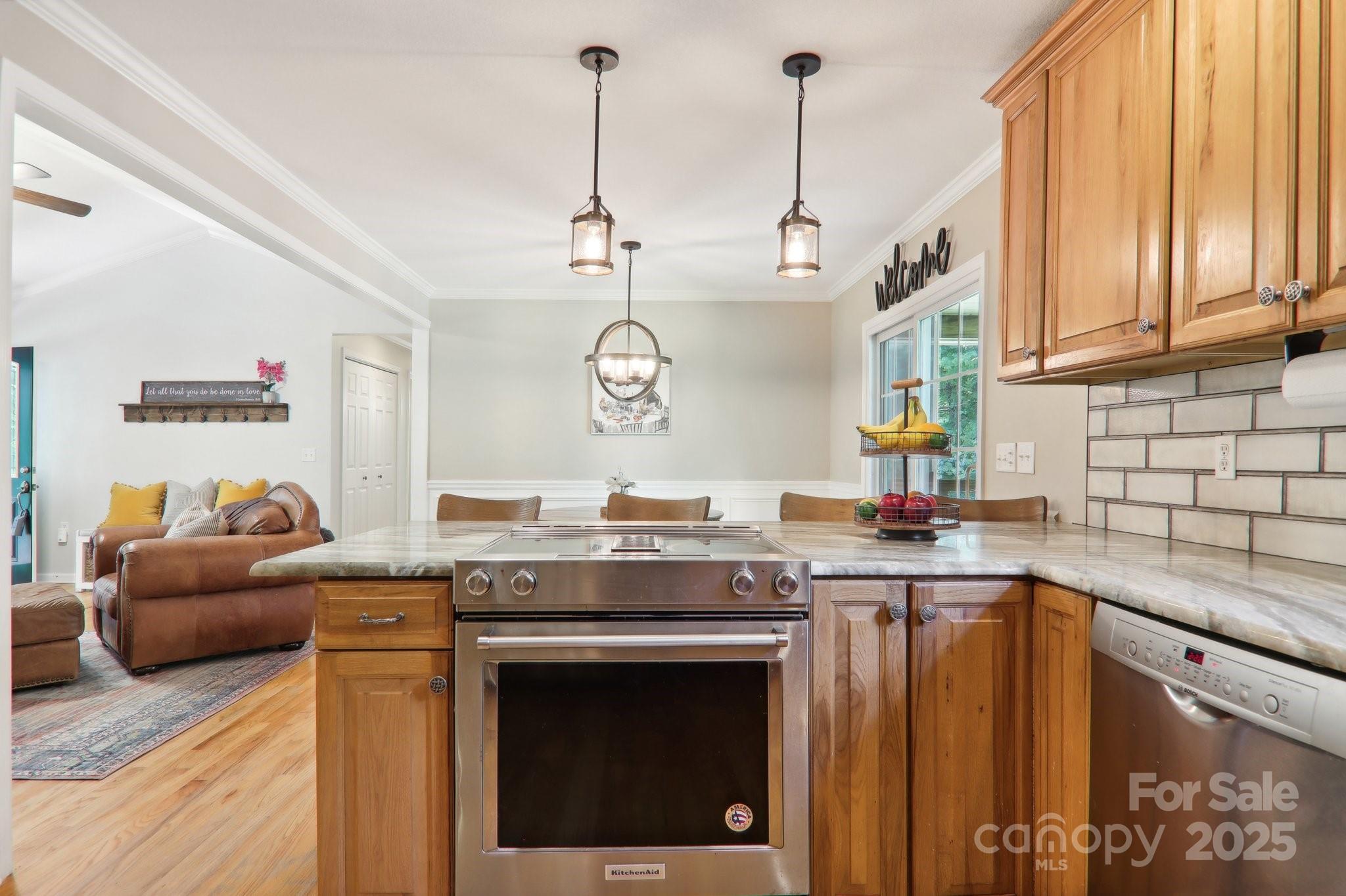 33 Warlick Road Mills River, NC 28759 - Photo 24 of 48 a kitchen with stainless steel appliances granite countertop a stove a sink and a microwave