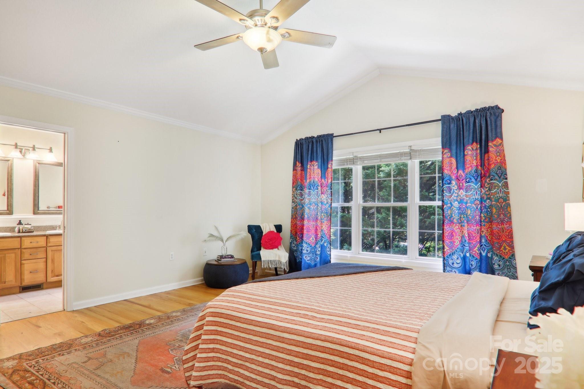 33 Warlick Road Mills River, NC 28759 - Photo 27 of 48 a bedroom with a bed and a chandelier
