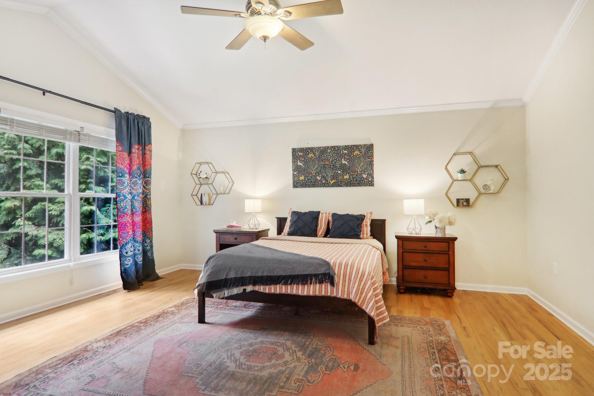33 Warlick Road Mills River, NC 28759 - Photo 30 of 48 a bedroom with a bed and a chandelier