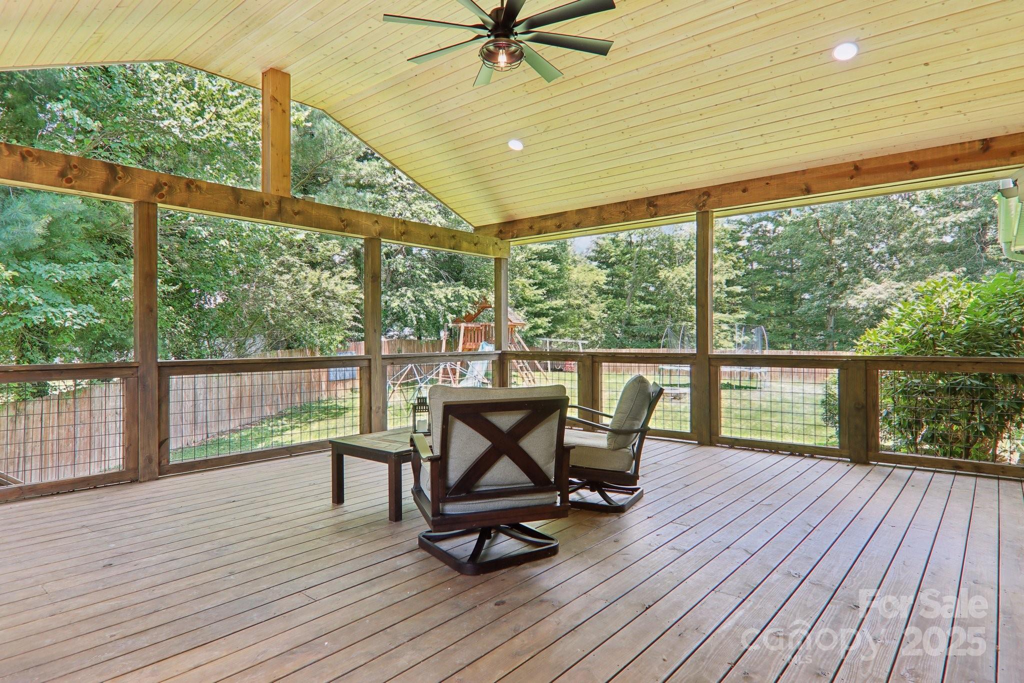 33 Warlick Road Mills River, NC 28759 - Photo 41 of 48 a view of a balcony with chairs and wooden floor