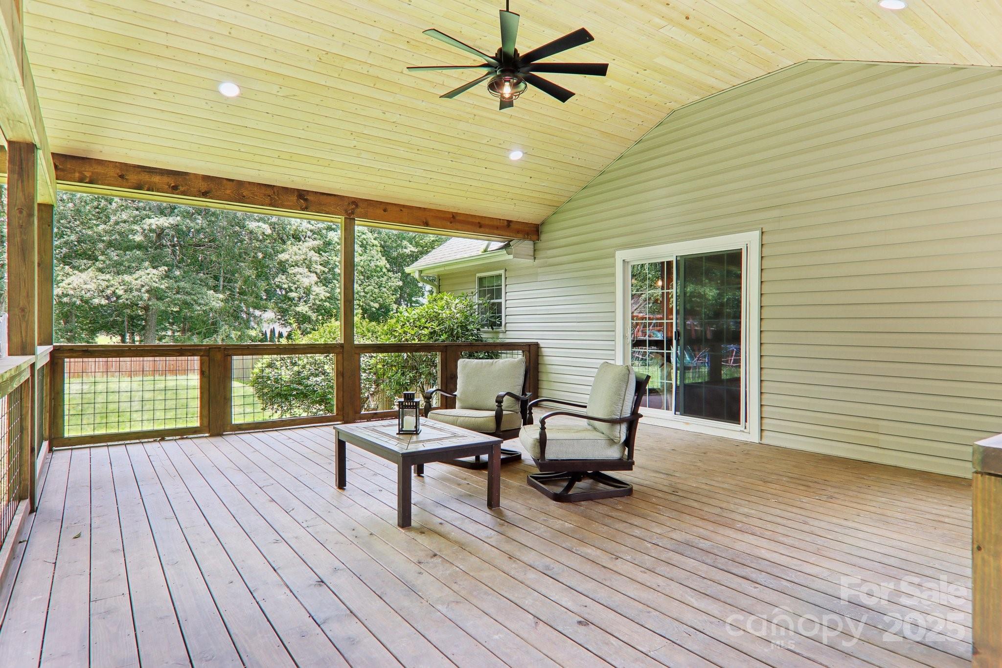 33 Warlick Road Mills River, NC 28759 - Photo 5 of 48 a balcony with wooden floor table and chairs