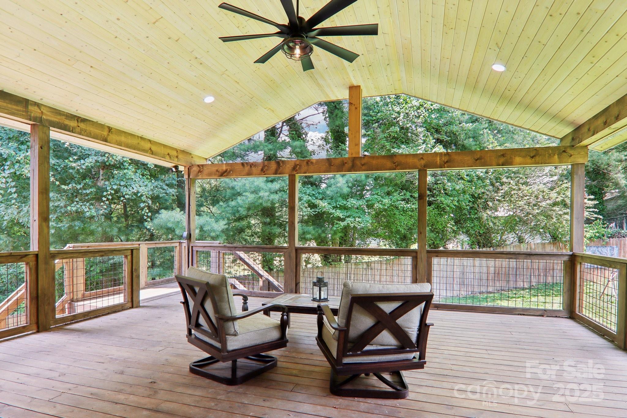 33 Warlick Road Mills River, NC 28759 - Photo 6 of 48 a view of a patio with table and chairs and wooden floor