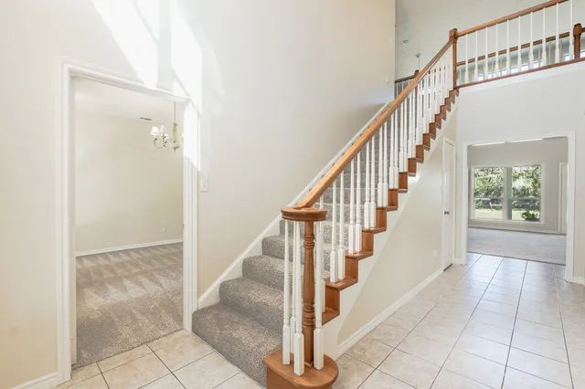 a view of entryway and hall with a floor to ceiling window