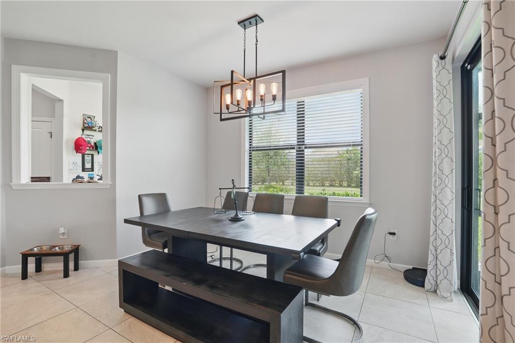 4934 Seton Way Ave Maria, FL 34142 - Photo 15 of 49 a view of a dining room with furniture window and outside view