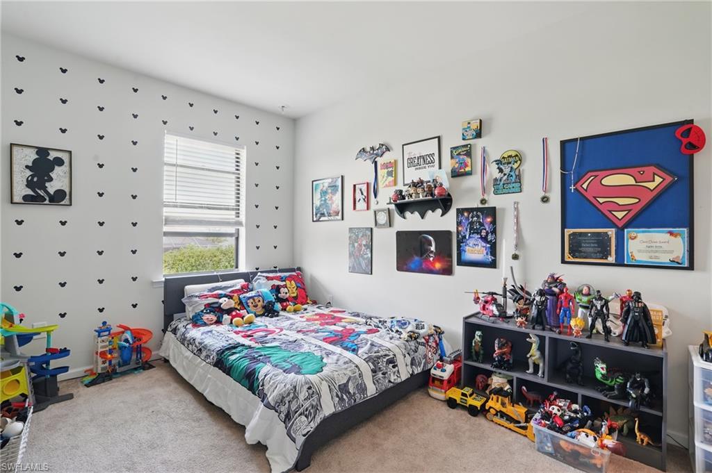 4934 Seton Way Ave Maria, FL 34142 - Photo 24 of 49 a bedroom with furniture and a bedroom