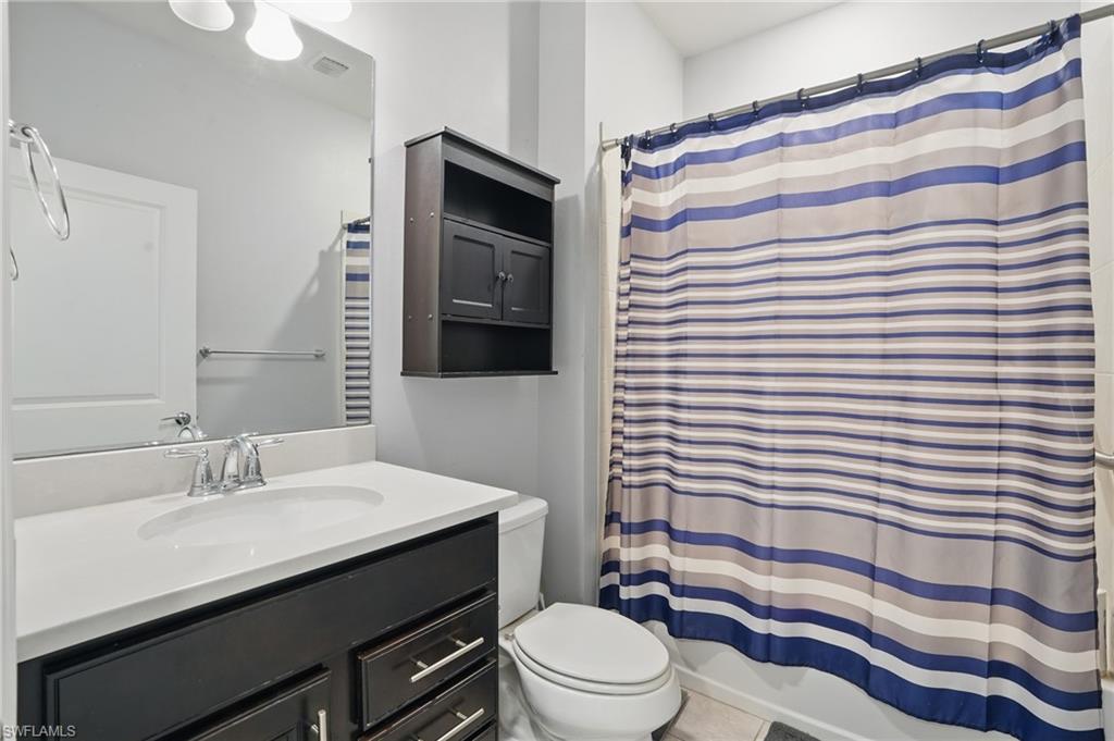 4934 Seton Way Ave Maria, FL 34142 - Photo 30 of 49 a bathroom with a sink a toilet a shower and a mirror