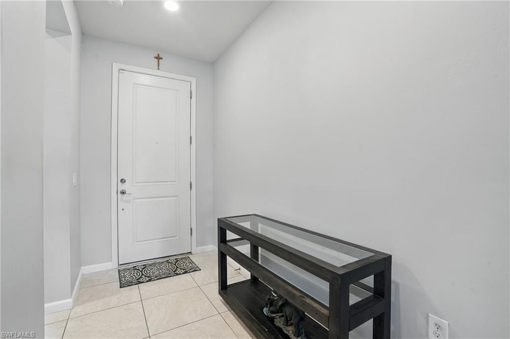 4934 Seton Way Ave Maria, FL 34142 - Photo 32 of 49 a view of room with window and a ceiling fan