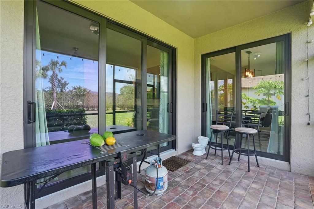 4934 Seton Way Ave Maria, FL 34142 - Photo 35 of 49 a view of a dining room with furniture window and outside view