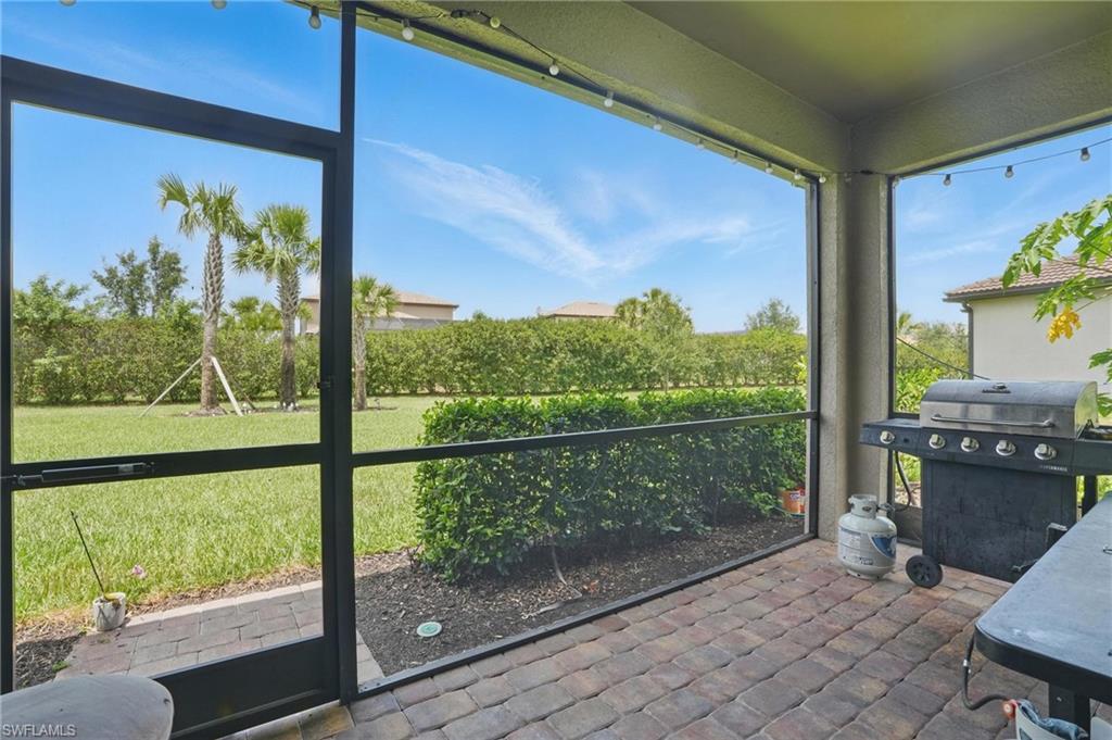 4934 Seton Way Ave Maria, FL 34142 - Photo 40 of 49 a living room with large windows