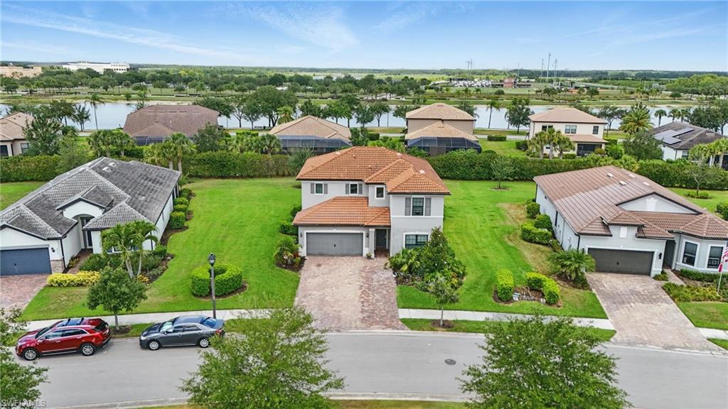 4934 Seton Way Ave Maria, FL 34142 - Photo 41 of 49 an aerial view of multiple houses with yard