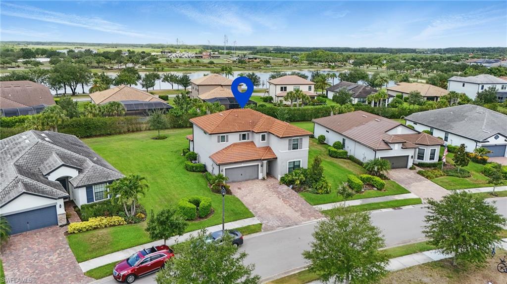 4934 Seton Way Ave Maria, FL 34142 - Photo 43 of 49 an aerial view of a house with a garden