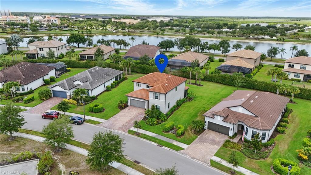4934 Seton Way Ave Maria, FL 34142 - Photo 45 of 49 an aerial view of multiple houses with yard