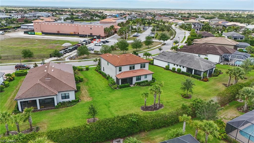 4934 Seton Way Ave Maria, FL 34142 - Photo 46 of 49 an aerial view of a house with a garden and lake view