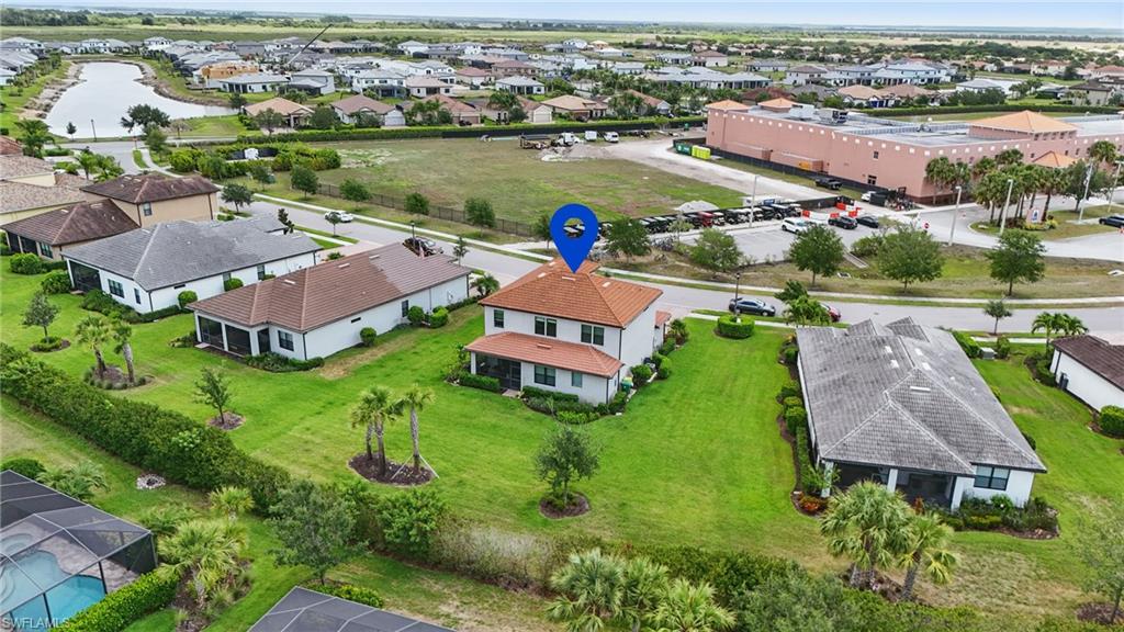 4934 Seton Way Ave Maria, FL 34142 - Photo 49 of 49 an aerial view of a house with outdoor space and lake view in back