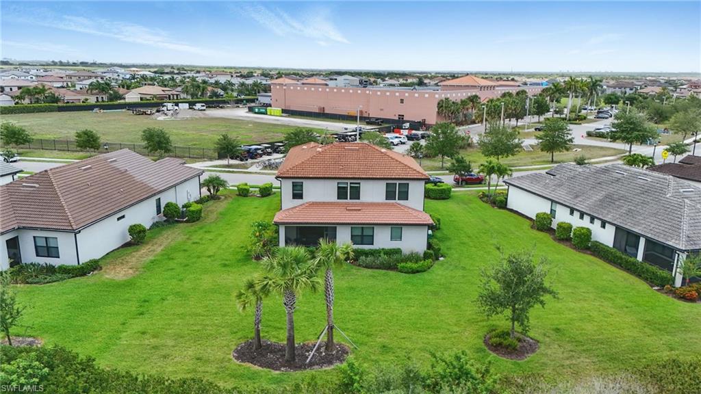4934 Seton Way Ave Maria, FL 34142 - Photo 5 of 49 an aerial view of a house with swimming pool a yard and lake view