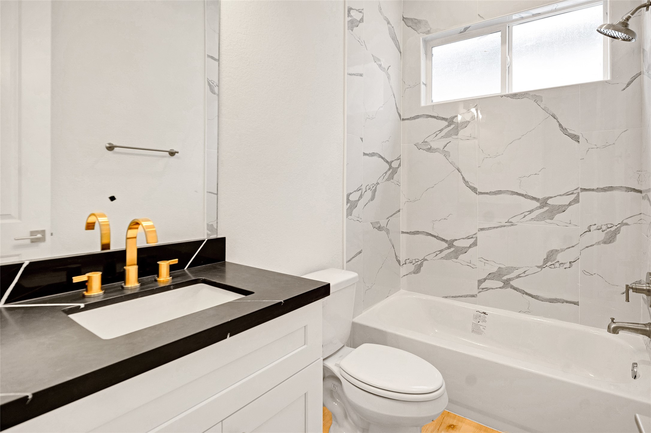 5908 St Augustine Street, Unit F Houston, TX 77021 - Photo 20 of 35 a bathroom with a sink a toilet and bathtub