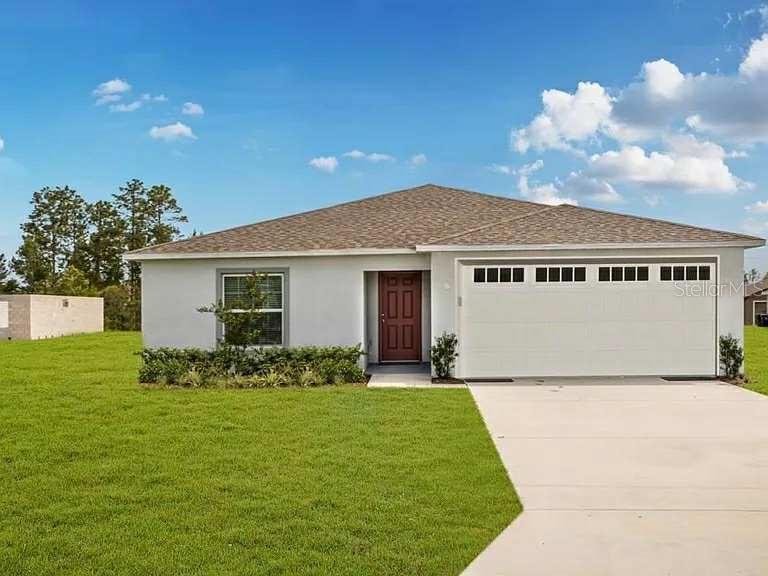 6535 East Gentry Street Inverness, FL 34452 - Photo 1 of 1 a front view of a house with garden