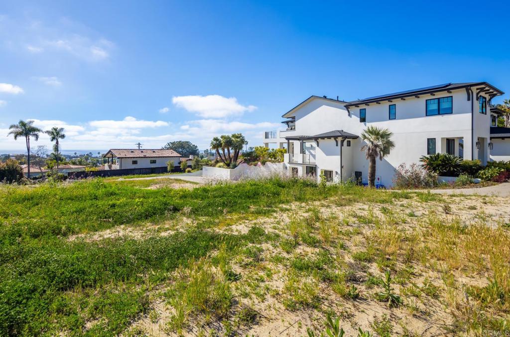 397 Sunset Drive Encinitas, CA 92024 - Photo 11 of 15 a front view of a house with a yard