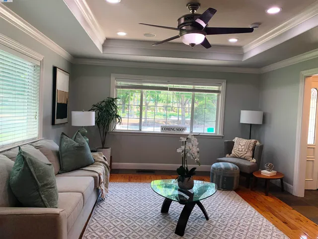 a dining room with furniture and window