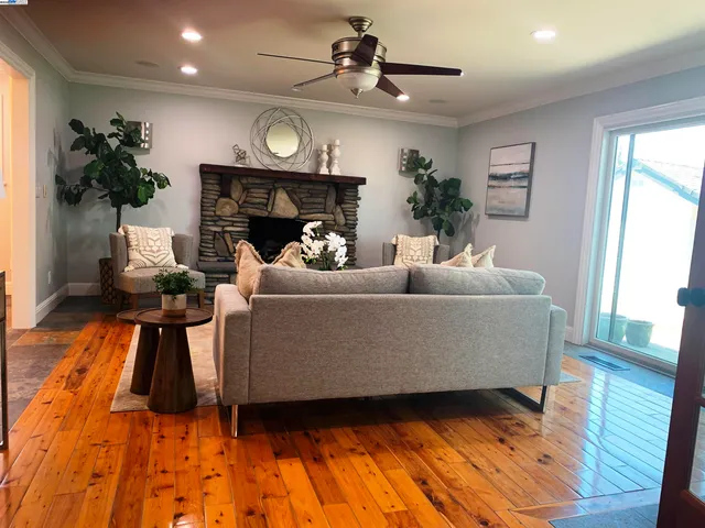 a living room with furniture a lamp and a fireplace