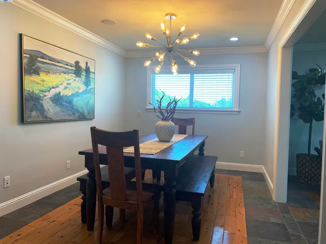 a living room with furniture a fireplace and a large window