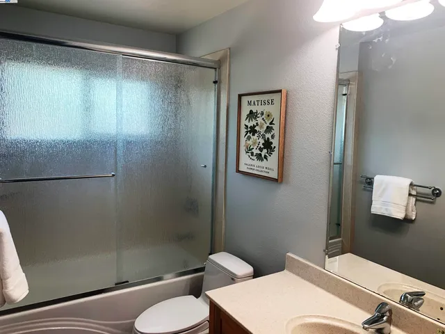 a view of a livingroom with furniture and a window