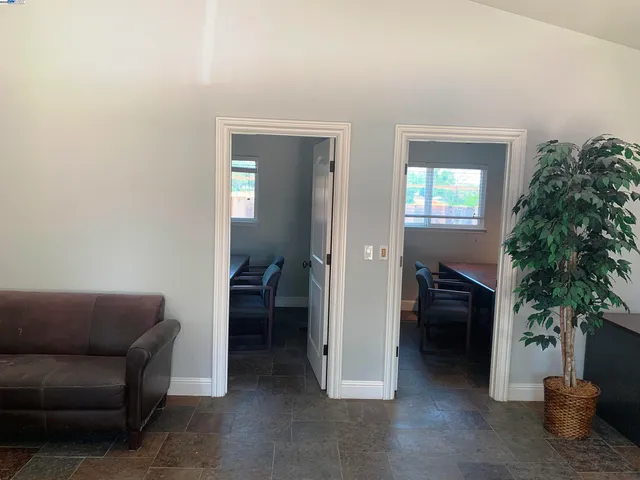 a view of a swimming pool with an outdoor space and seating area