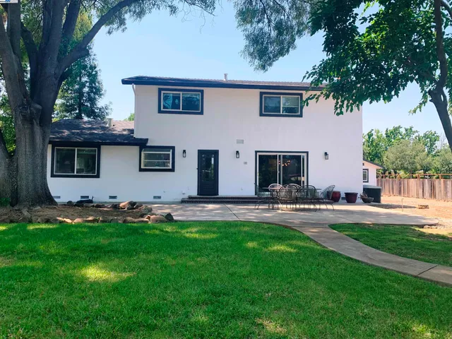 a view of a park with slide and a bench