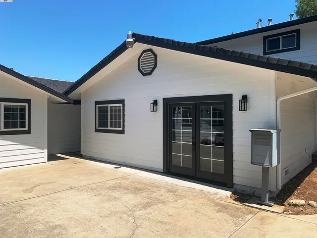 a view of a yard in front of a house
