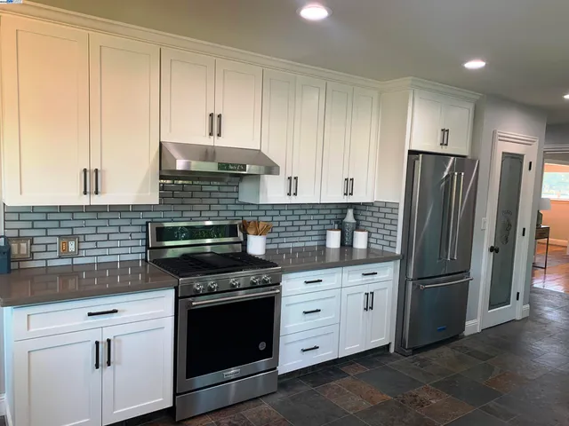 a living room with furniture rug and window