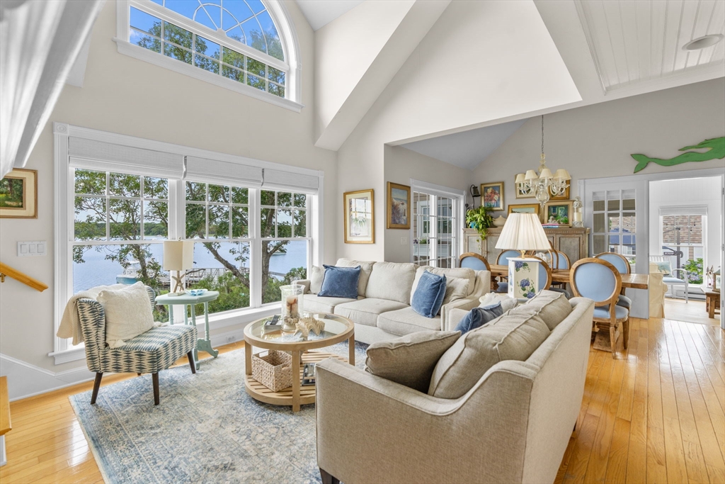 265 Monomoscoy Road Mashpee, MA 02649 - Photo 24 of 39 a living room with furniture and a table