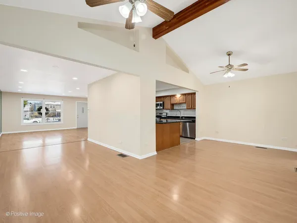 a view of kitchen with microwave and cabinets
