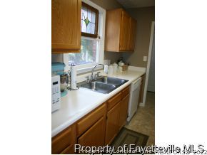 5018 Summer Ridge Road Fayetteville, NC 28303 - Photo 3 of 10 a bathroom with a sink and a mirror