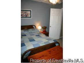 5018 Summer Ridge Road Fayetteville, NC 28303 - Photo 8 of 10 a picture of a living room with a rug