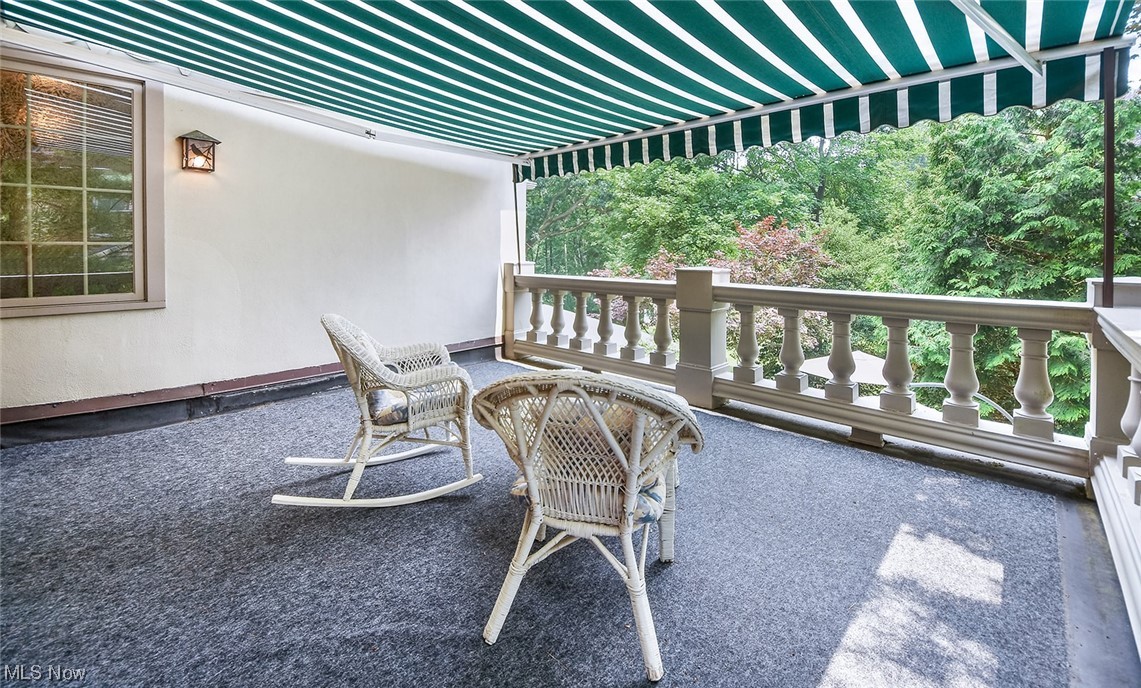 681 Merriman Road Akron, OH 44303 - Photo 22 of 43 View of the balcony off the owner's ensuite. The awning is retractable. Newer indoor/outdoor carpet this past fall.