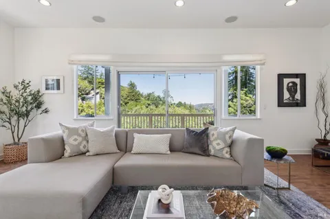 a view of a dining room with furniture window and outside view